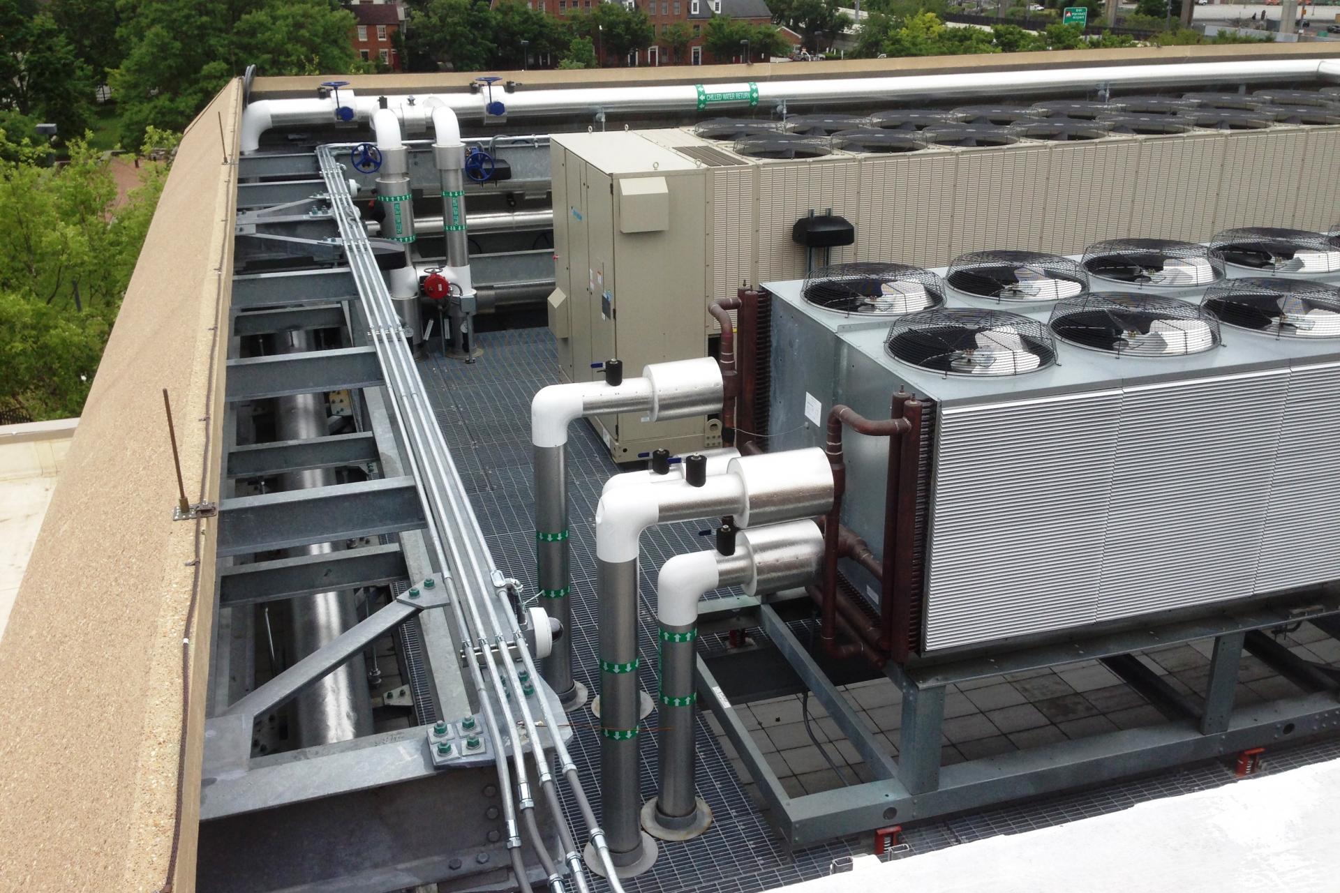 The raised parapet walls provide protection and screening of the expanded plant.